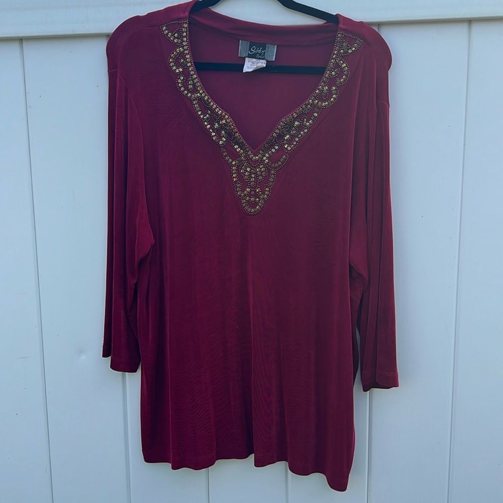Slinky red  top w/ metal beading  and 3/4 Sleeve size 1x